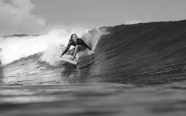 22. female-surfer-on-a-blue-wave-2021-09-01-20-42-33-utc